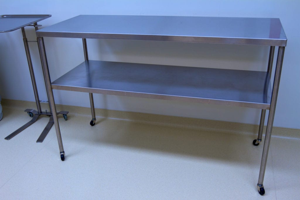 Full shot of stainless steel hospital table.